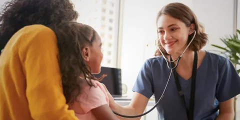 Nurse and child with mother